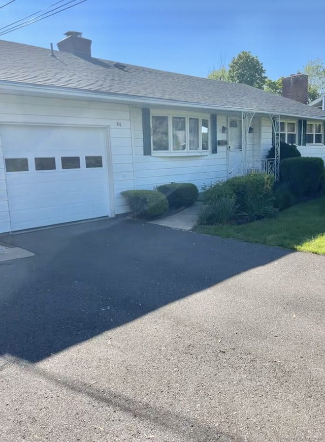 20 Regency Dr, West Hartford, CT 06110 - single story home featuring driveway, a chimney, a garage, and a shingled roof