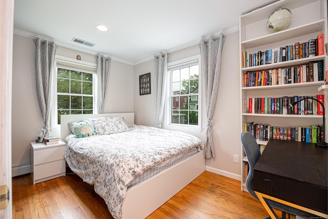23 Hale St, Westport, CT 06880 - bedroom with a baseboard radiator, multiple windows, wood finished floors, crown molding, and baseboards