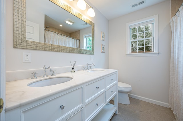 23 Hale St, Westport, CT 06880 - bathroom with healthy amount of natural light, double vanity, toilet, and tile patterned flooring
