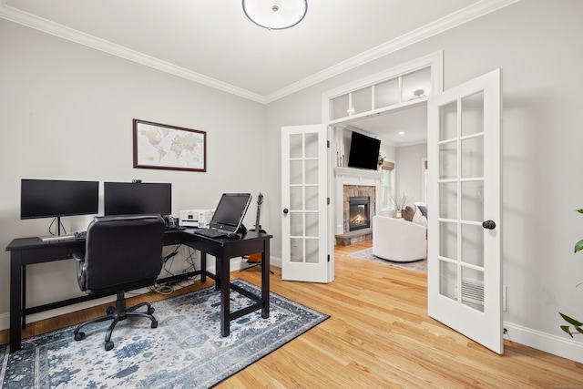 261 W St, Hebron, CT 06248 - office with french doors, ornamental molding, wood finished floors, a stone fireplace, and baseboards