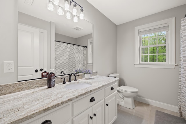 261 W St, Hebron, CT 06248 - bathroom featuring baseboards, toilet, vanity, and tile patterned floors
