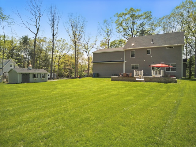 261 W St, Hebron, CT 06248 - back of property with a lawn