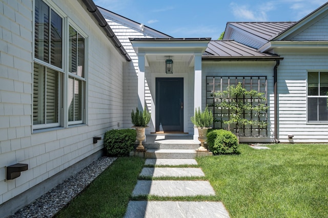 7 Hanna Ln, Essex, CT 06426 - entrance to property featuring a standing seam roof, a metal roof, and a lawn