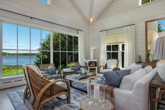 7 Hanna Ln, Essex, CT 06426 - sunroom / solarium featuring wood finished floors, wood walls, high vaulted ceiling, baseboard heating, and a water view