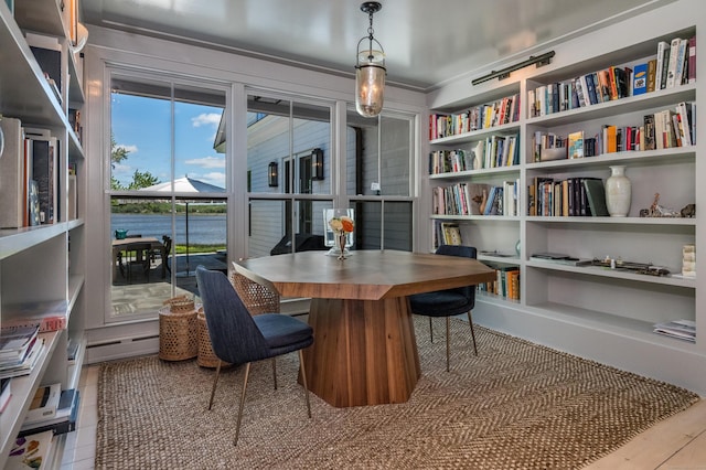7 Hanna Ln, Essex, CT 06426 - dining area featuring built in shelves and an office area