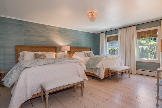 7 Hanna Ln, Essex, CT 06426 - bedroom with baseboard heating, wallpapered walls, and light wood finished floors