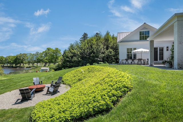 7 Hanna Ln, Essex, CT 06426 - view of grassy yard featuring a patio and a water view