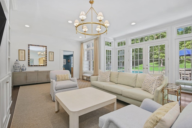 49 Dogwood Ln, New Canaan, CT 06840 - living area featuring a chandelier, french doors, recessed lighting, and ornamental molding