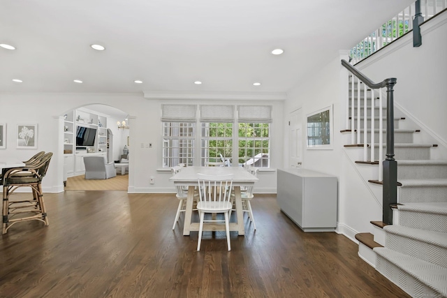 49 Dogwood Ln, New Canaan, CT 06840 - dining area featuring arched walkways, wood finished floors, stairway, recessed lighting, and baseboards