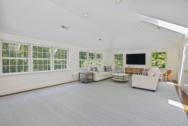 49 Dogwood Ln, New Canaan, CT 06840 - living area with plenty of natural light, vaulted ceiling, a skylight, baseboards, and recessed lighting