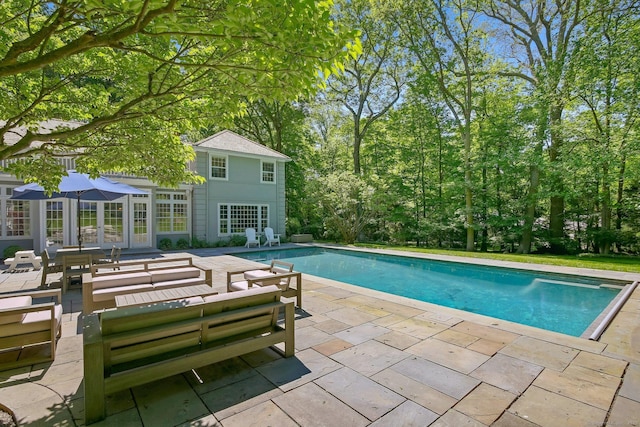 49 Dogwood Ln, New Canaan, CT 06840 - swimming pool with an exterior structure, a patio area, an outbuilding, and outdoor lounge area