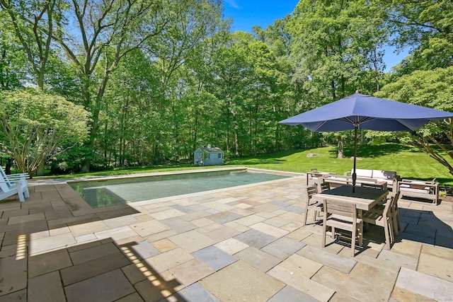 49 Dogwood Ln, New Canaan, CT 06840 - swimming pool featuring a patio area, outdoor dining space, and a yard
