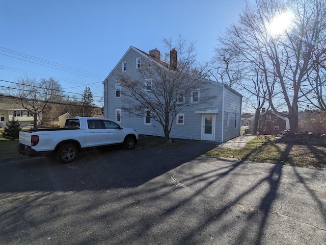 386 Platt Ave, West Haven, CT 06516 - view of property exterior with a chimney