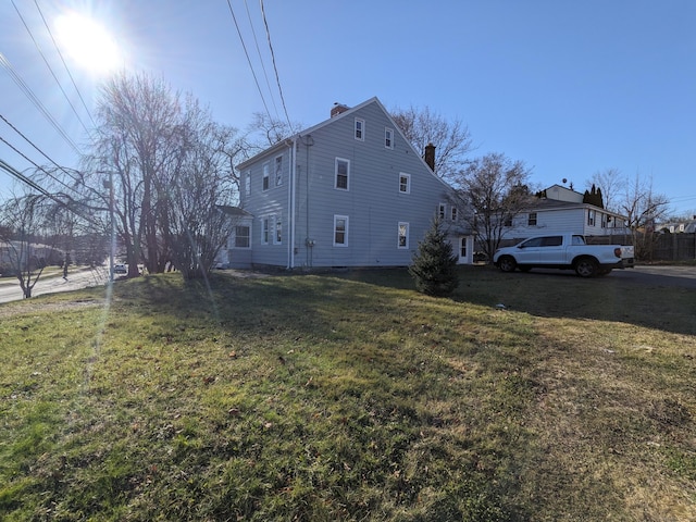 386 Platt Ave, West Haven, CT 06516 - view of side of home with a chimney and a lawn