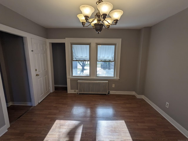 386 Platt Ave, West Haven, CT 06516 - unfurnished dining area with radiator heating unit, a chandelier, dark wood finished floors, and baseboards