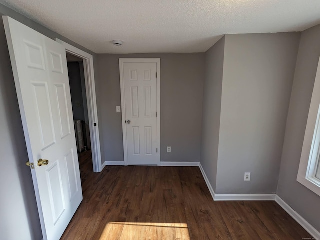 386 Platt Ave, West Haven, CT 06516 - hall with dark wood-style flooring, baseboards, and a textured ceiling