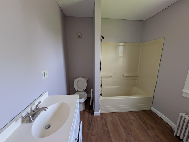 386 Platt Ave, West Haven, CT 06516 - full bath featuring radiator, wood finished floors, toilet, vanity, and baseboards