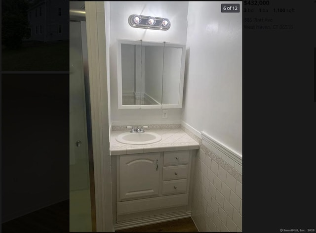 386 Platt Ave, West Haven, CT 06516 - bathroom with a wainscoted wall and vanity
