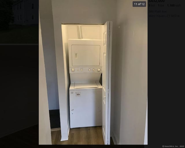 386 Platt Ave, West Haven, CT 06516 - laundry room with stacked washing machine and dryer, wood finished floors, and baseboards