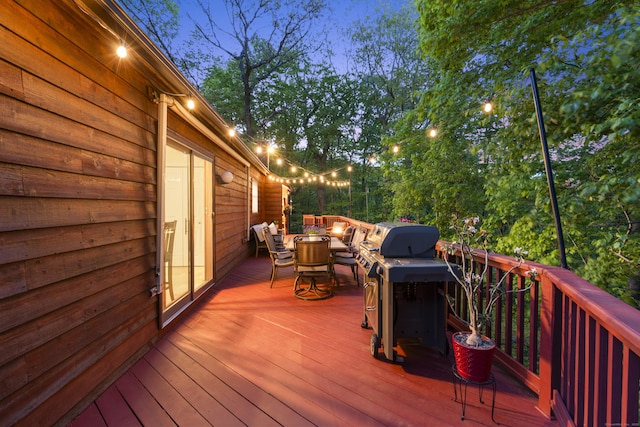 deck with outdoor dining area