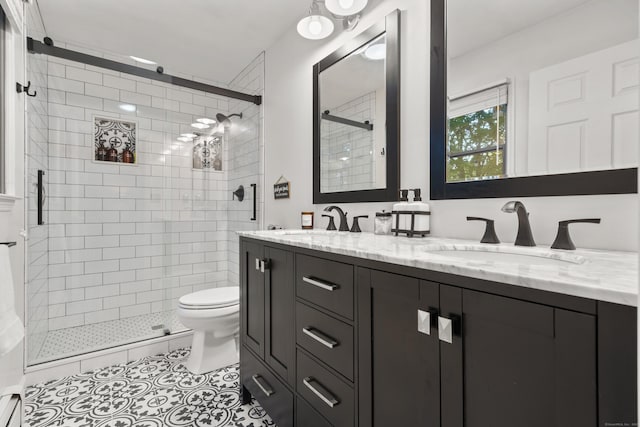 full bathroom featuring a shower stall, toilet, double vanity, tile patterned floors, and a baseboard radiator