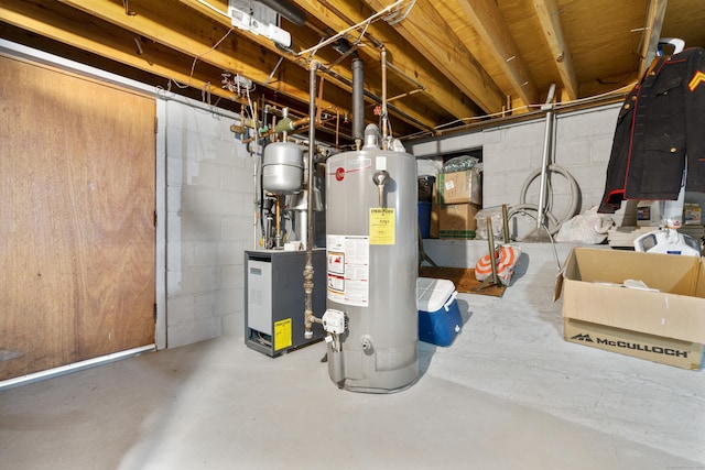 unfinished below grade area featuring water heater and a heating unit