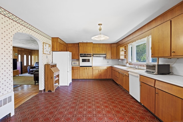 241 Clarks Falls Rd, North Stonington, CT 06359 - kitchen featuring white appliances, radiator heating unit, light countertops, open shelves, and dark floors