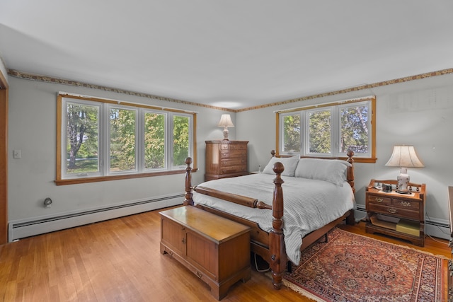 241 Clarks Falls Rd, North Stonington, CT 06359 - bedroom with a baseboard radiator and light wood-type flooring
