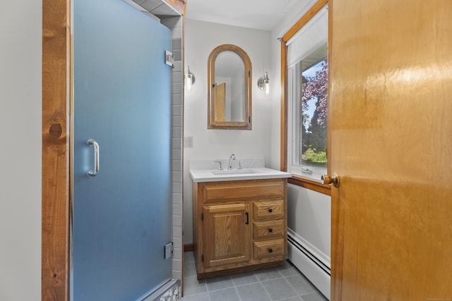 241 Clarks Falls Rd, North Stonington, CT 06359 - bathroom featuring a baseboard heating unit, tile patterned flooring, and vanity