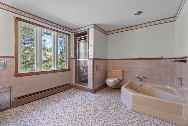 241 Clarks Falls Rd, North Stonington, CT 06359 - full bath with a baseboard heating unit, tile walls, toilet, wainscoting, and a garden tub