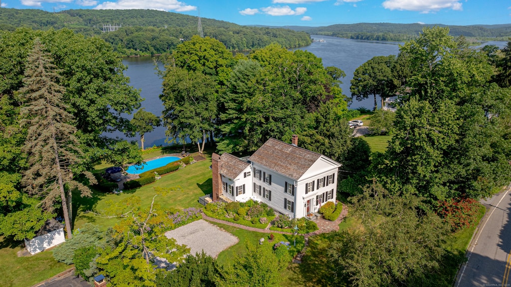 55 Main St, East Haddam, CT 06423 - aerial view of property and surrounding area with a nearby body of water, a forest, and a pool