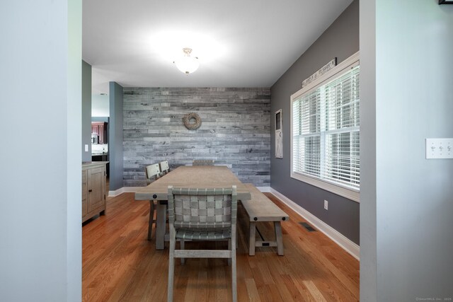 123 Cobblestone Dr, Southington, CT 06479 - dining space with an accent wall, baseboards, and wood finished floors