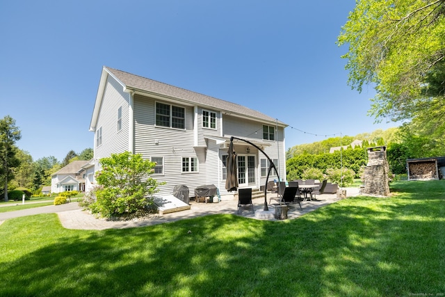 123 Cobblestone Dr, Southington, CT 06479 - back of property with a lawn and a patio area