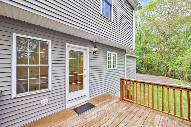 wooden terrace with a yard