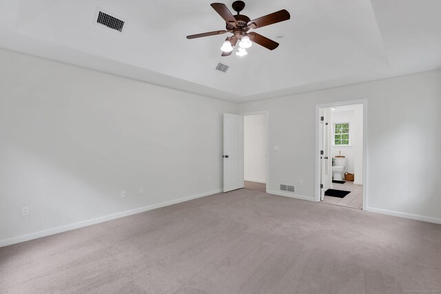 unfurnished bedroom with carpet, baseboards, ensuite bath, and ceiling fan