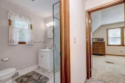 32 Lenox Ave, Norwalk, CT 06854 - full bathroom featuring vanity, toilet, and baseboards