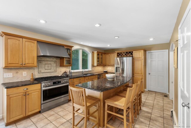 15 Westwood Rd, Essex, CT 06442 - kitchen with appliances with stainless steel finishes, extractor fan, a sink, glass insert cabinets, and a kitchen bar