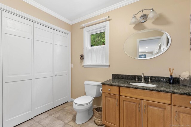 15 Westwood Rd, Essex, CT 06442 - bathroom with toilet, ornamental molding, vanity, and baseboards