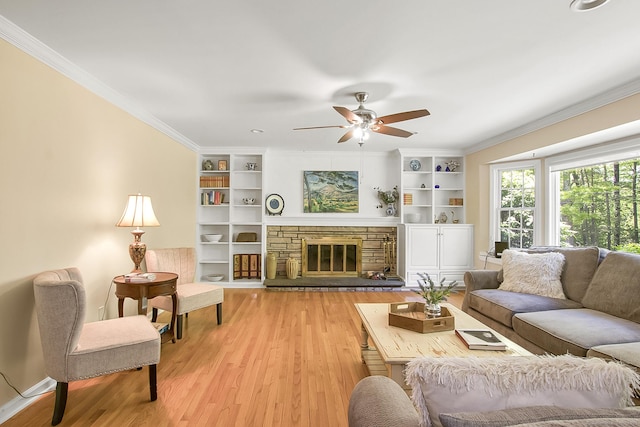 95 Vista Rd, Wilton, CT 06897 - living room with crown molding, light wood-style flooring, ceiling fan, built in shelves, and a fireplace