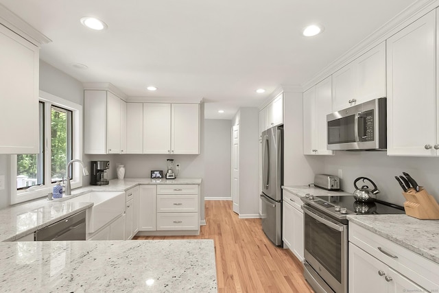 95 Vista Rd, Wilton, CT 06897 - kitchen with appliances with stainless steel finishes, white cabinets, recessed lighting, and light wood-style flooring