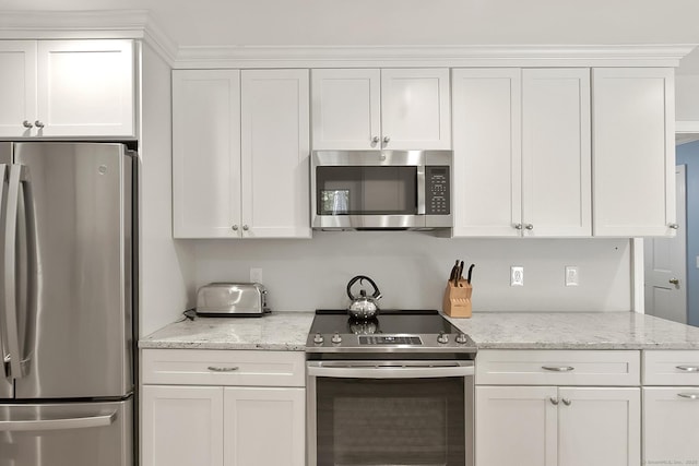 95 Vista Rd, Wilton, CT 06897 - kitchen featuring stainless steel appliances, white cabinets, and light stone counters