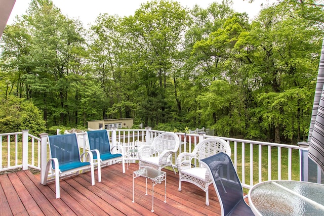 95 Vista Rd, Wilton, CT 06897 - deck featuring an outdoor structure, a storage shed, and view of scattered trees