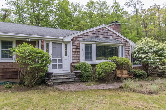 95 Vista Rd, Wilton, CT 06897 - view of front of home featuring a chimney, a front yard, and roof with shingles