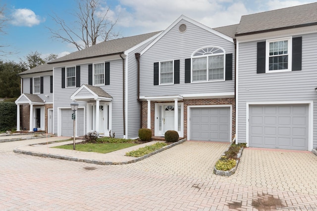 11 Norman Ln, Darien, CT 06820 - multi unit property with an attached garage, driveway, brick siding, and a shingled roof