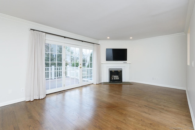 11 Norman Ln, Darien, CT 06820 - unfurnished living room with ornamental molding, wood finished floors, a fireplace with flush hearth, and recessed lighting
