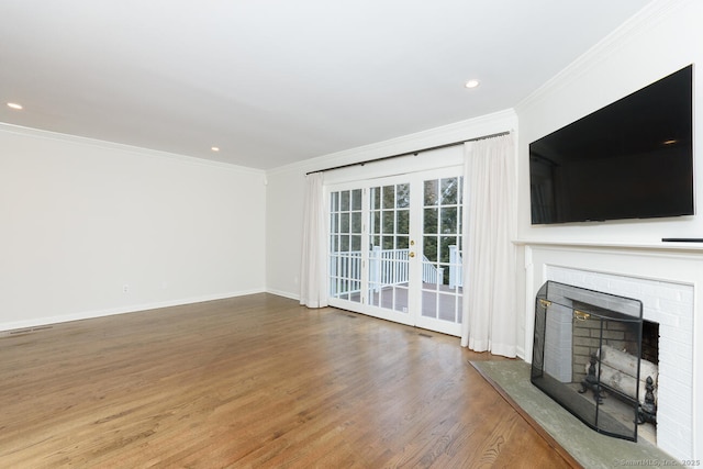 11 Norman Ln, Darien, CT 06820 - unfurnished living room with a fireplace with raised hearth, wood finished floors, crown molding, and recessed lighting