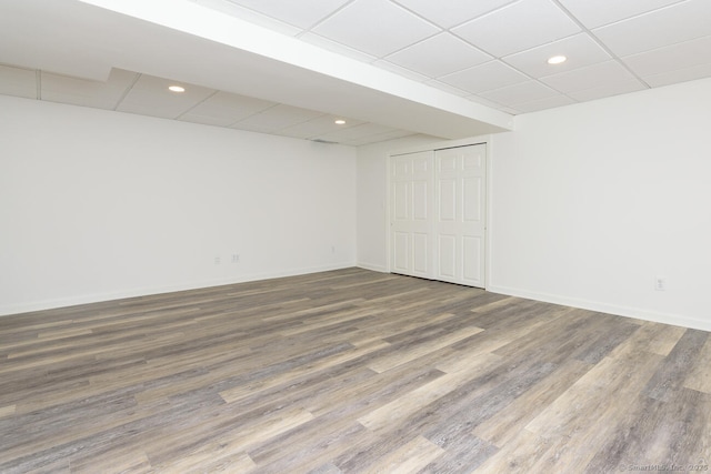 11 Norman Ln, Darien, CT 06820 - finished basement featuring a paneled ceiling, wood finished floors, and recessed lighting