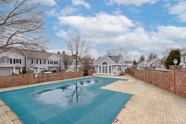 11 Norman Ln, Darien, CT 06820 - view of pool featuring a residential view, an exterior structure, a patio area, and an outdoor structure