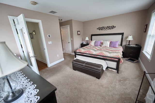 bedroom featuring carpet floors and baseboards