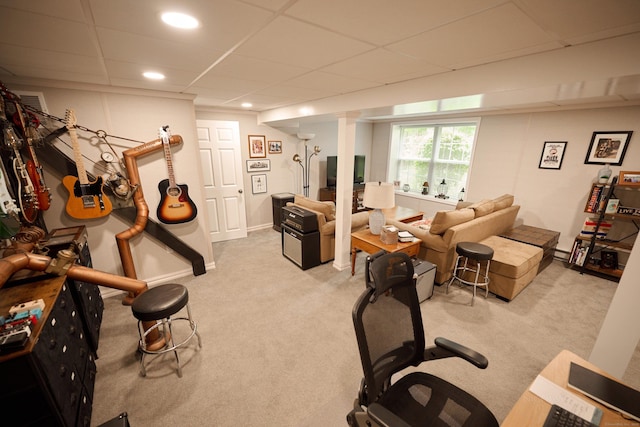 exercise area with light carpet, a drop ceiling, recessed lighting, and baseboards